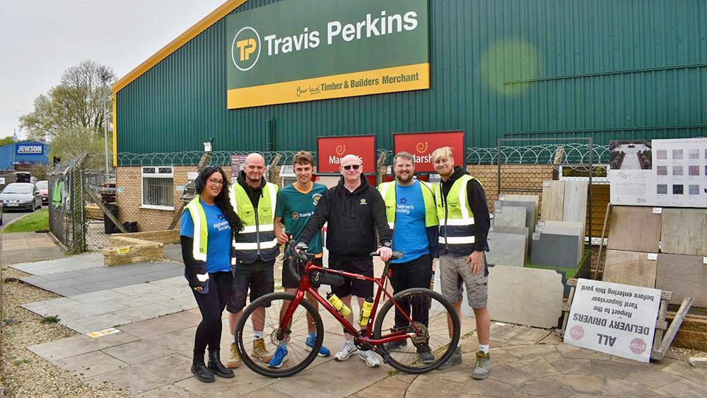 Travis Perkins duo completes 200km charity challenge image