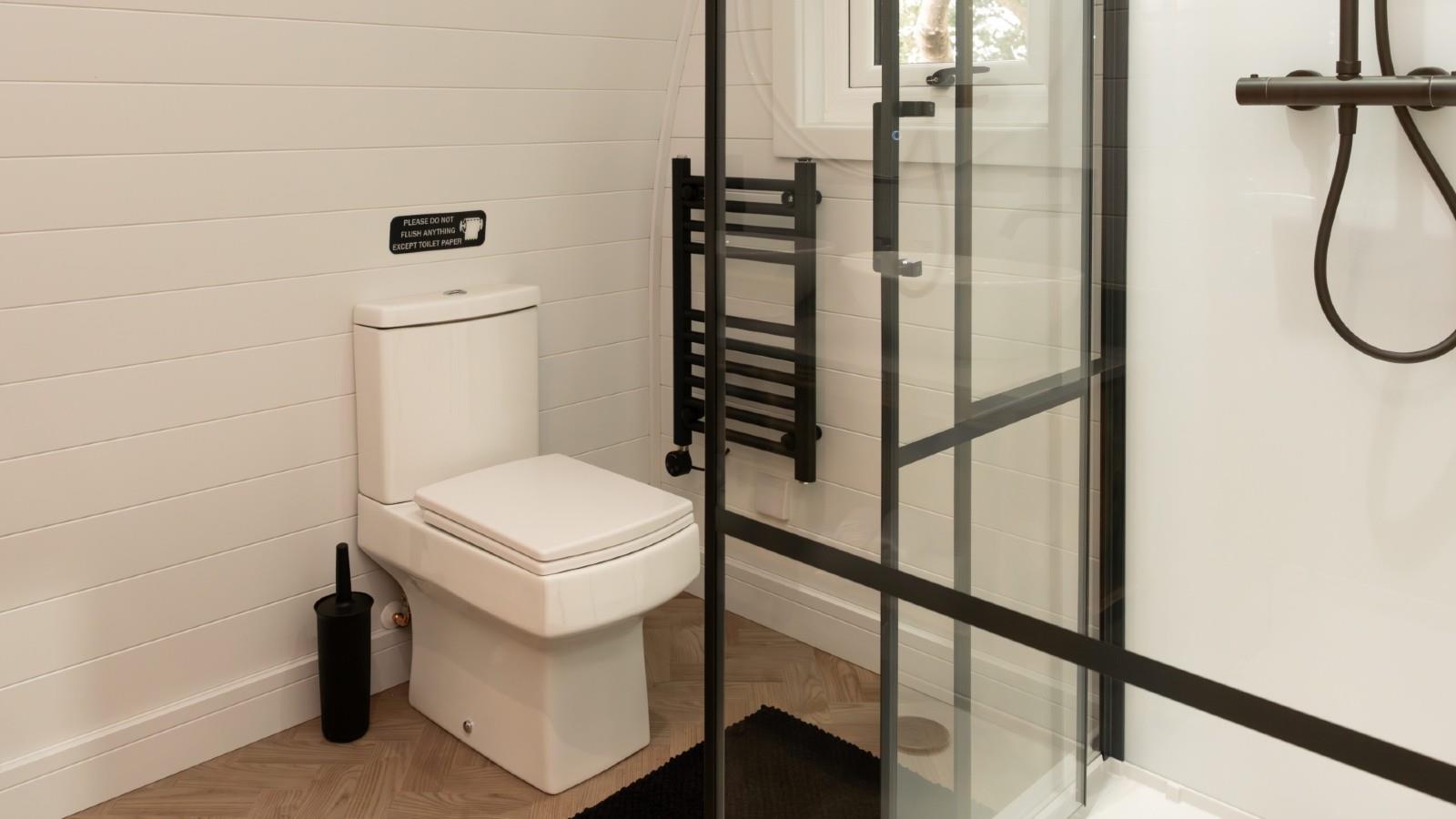 Luxury Glamping Pods at the NEC feature Kinedo shower cubicles  image