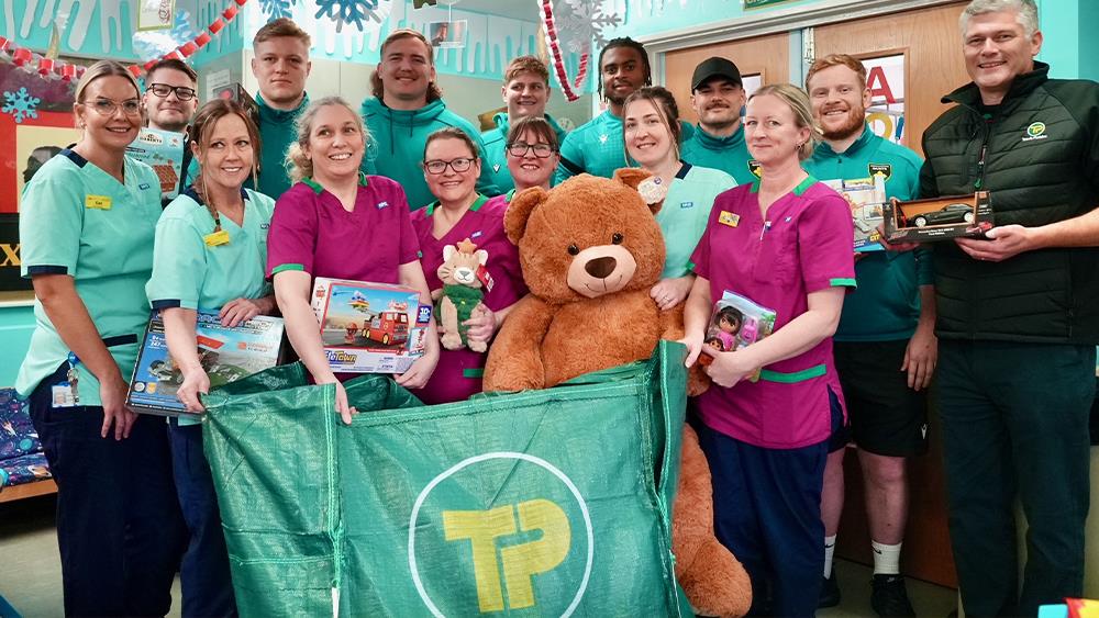 Northampton Saints and Travis Perkins deliver Christmas presents to the community image